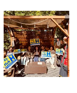 Coalition event with Yes on H signs